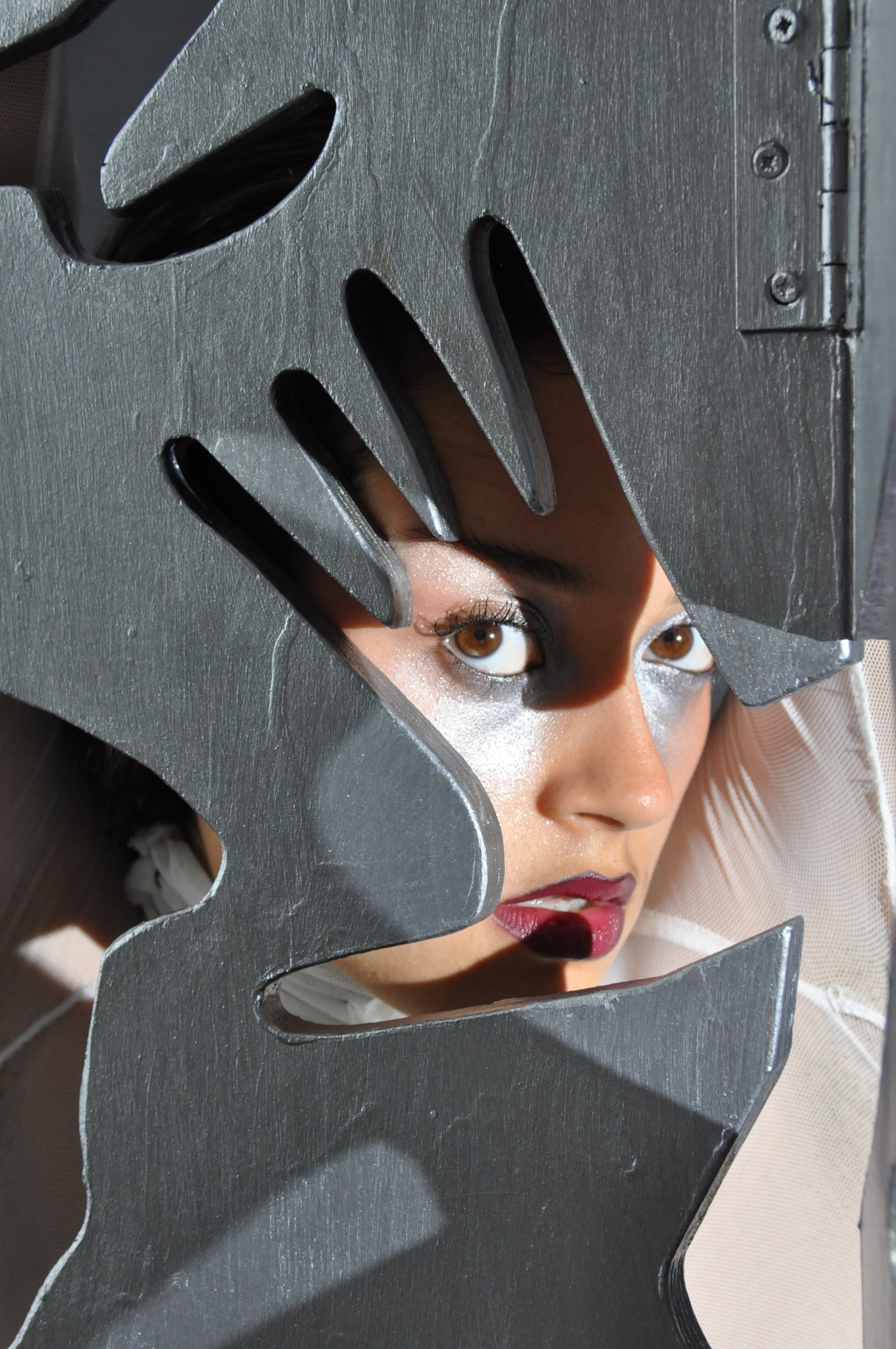 Performer framed by the forms of the Divided Choreography screen