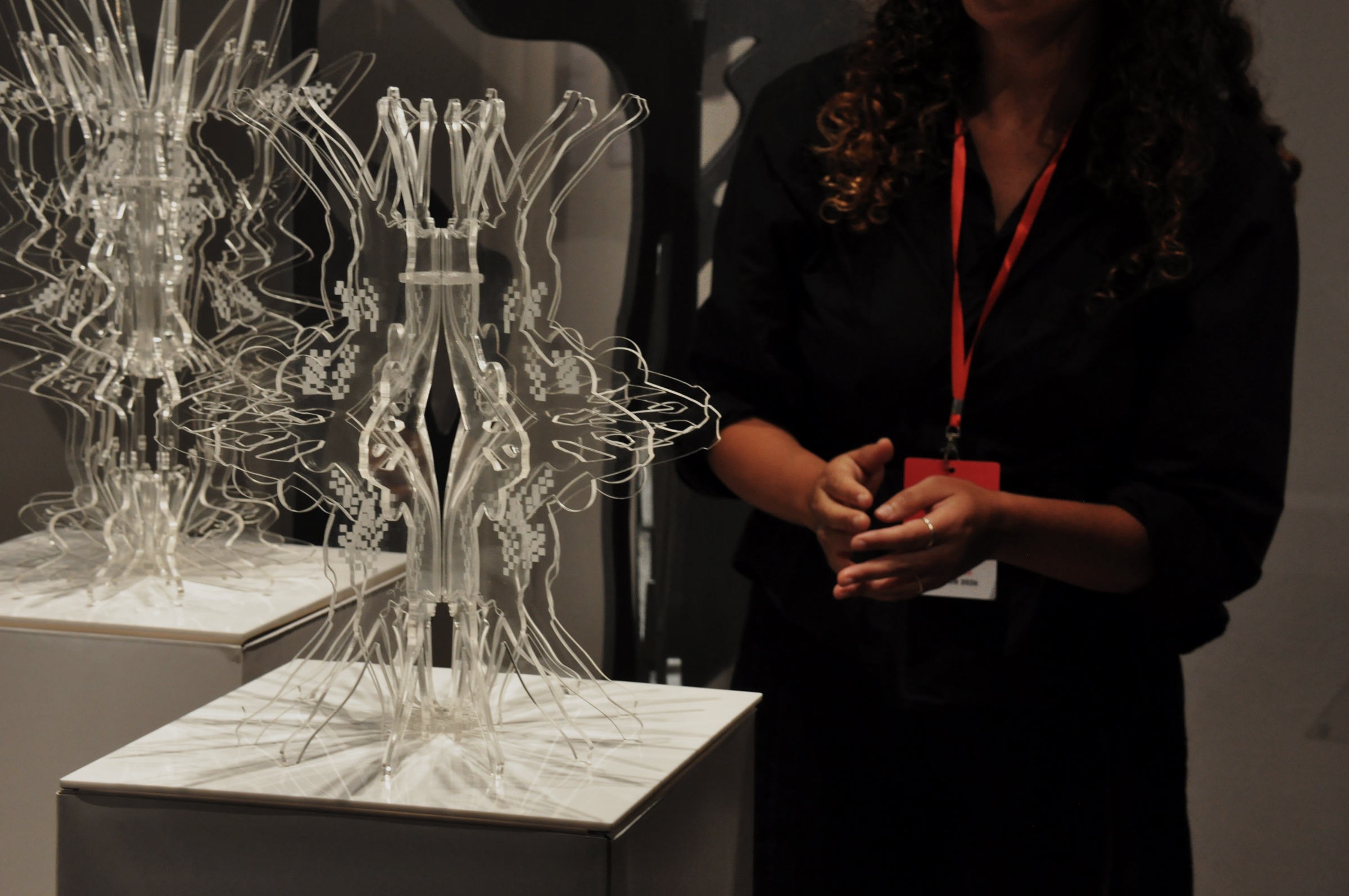 Layered transparent acrylic sculpture detail in the gallery