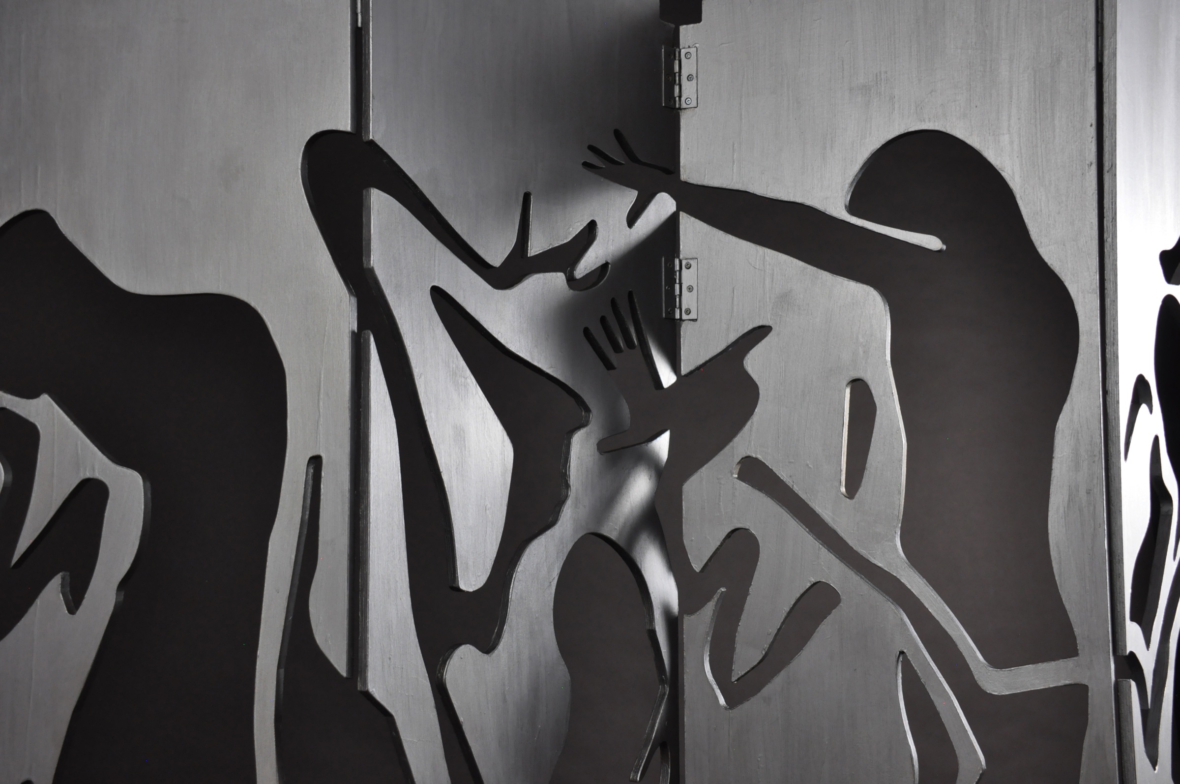 Metallic figure details across the divider panels
