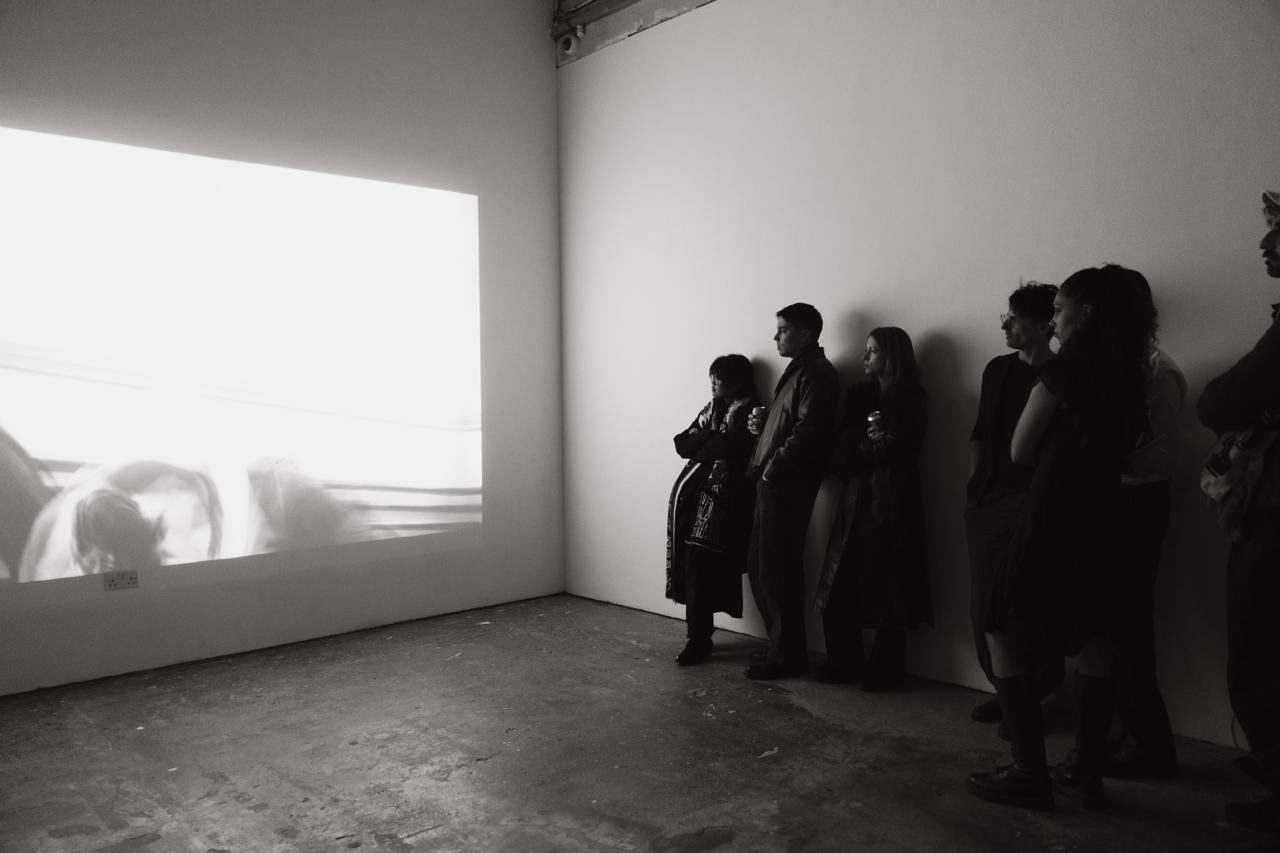 Dance. Film. Performance — audience watching projection